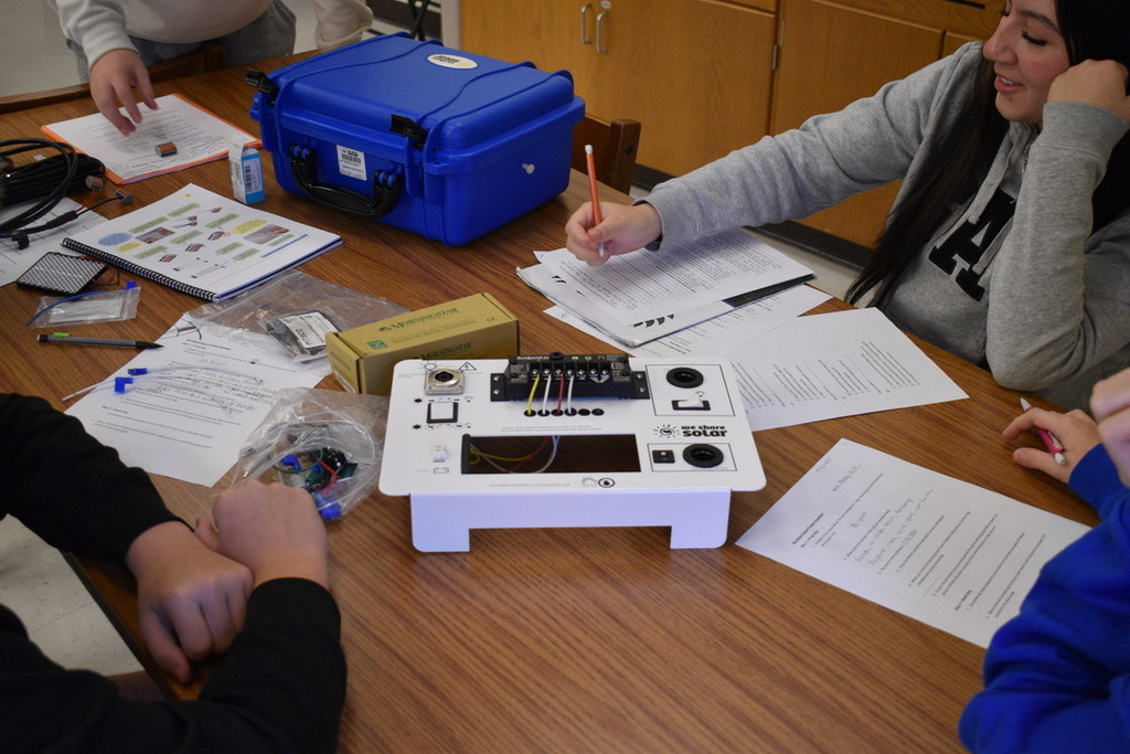 Students working on STEM solar suitcase project