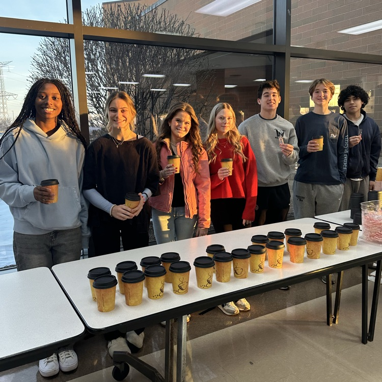 students holding hot chocolate
