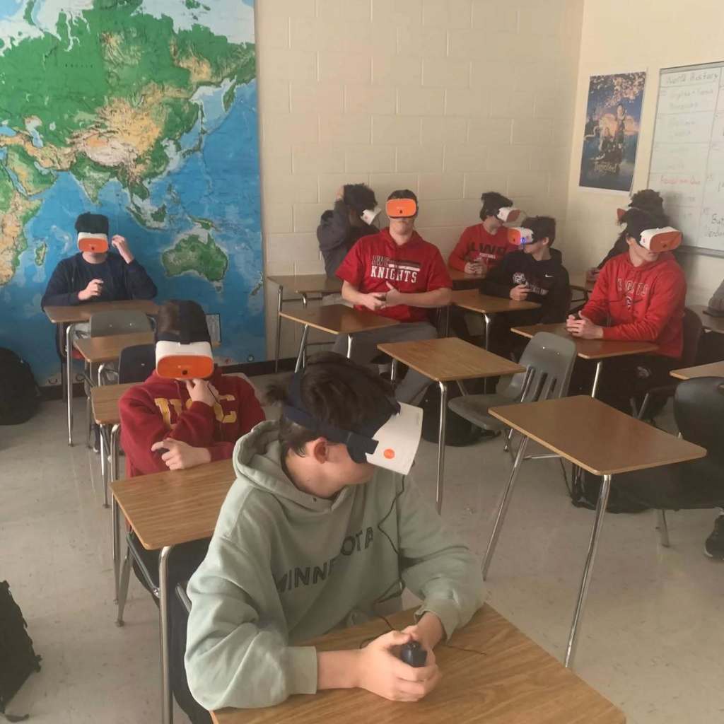 Students using VR glasses in a classroom