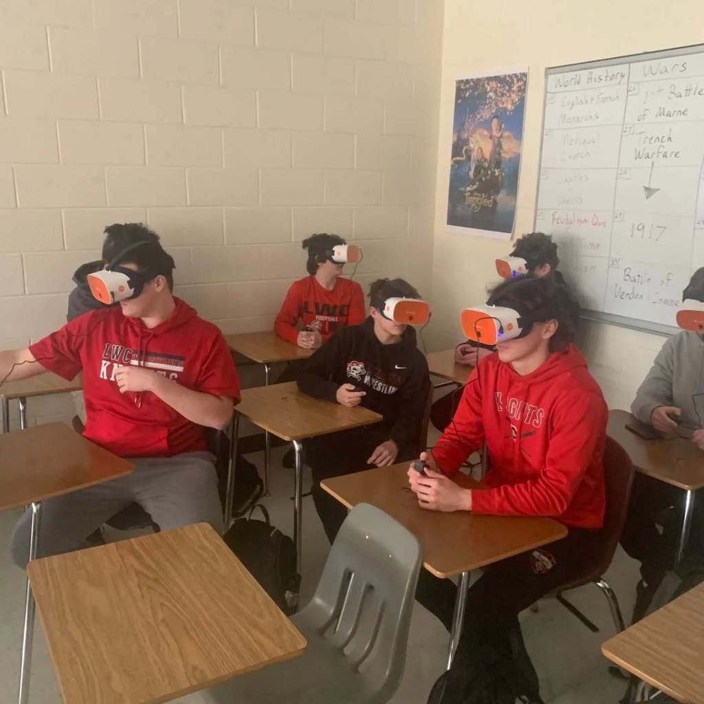 Students using VR glasses in a classroom