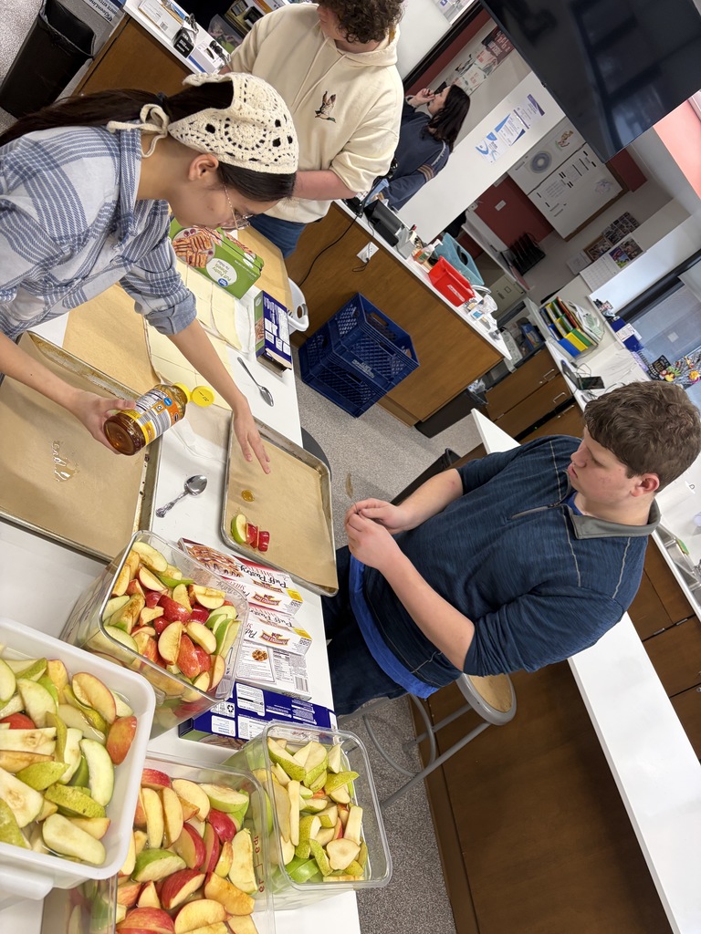 Students preparing desserts in the classroom kitchen
