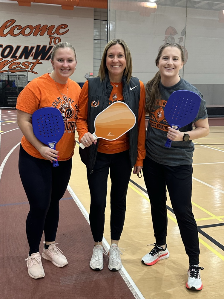 staff with pickleball paddles
