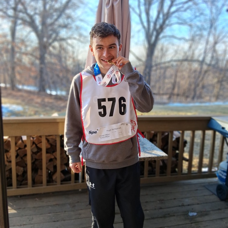 student with gold medal