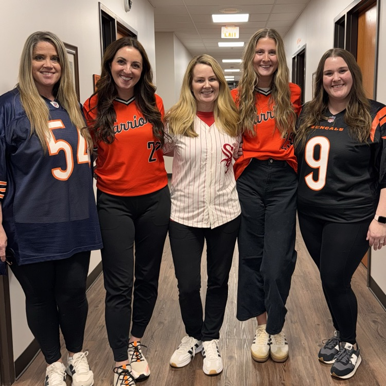staff in sports jerseys