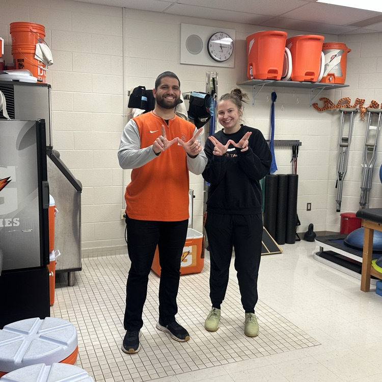 staff wearing orange