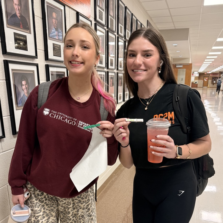 students holding kindness clips