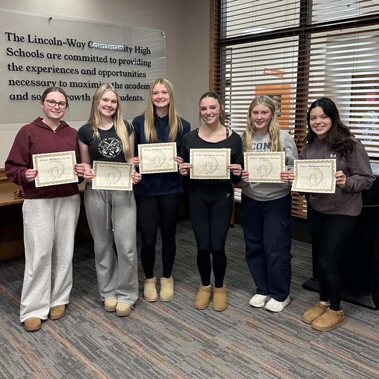 students holding certificates