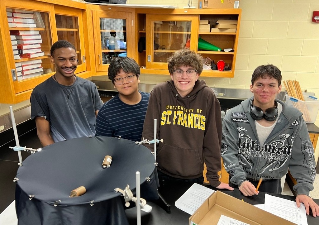 Mr. Tucker's Astronomy classes analyzed "space-time" surfaces by rolling marbles. This allowed students to see how mass warps space and how that curvature guides motion.