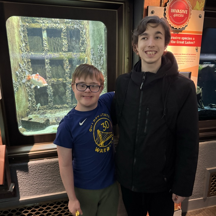 students in front of fish