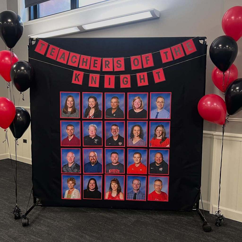 Photos of people displayed on a black backdrop with "Teachers of the Knight" banner. Black and red balloons surround the display.