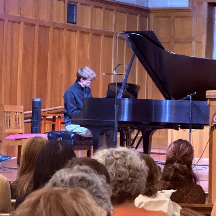 student playing the piano at the event
