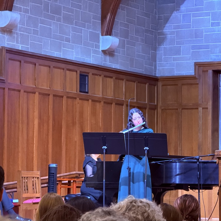 student playing the flute at the recital