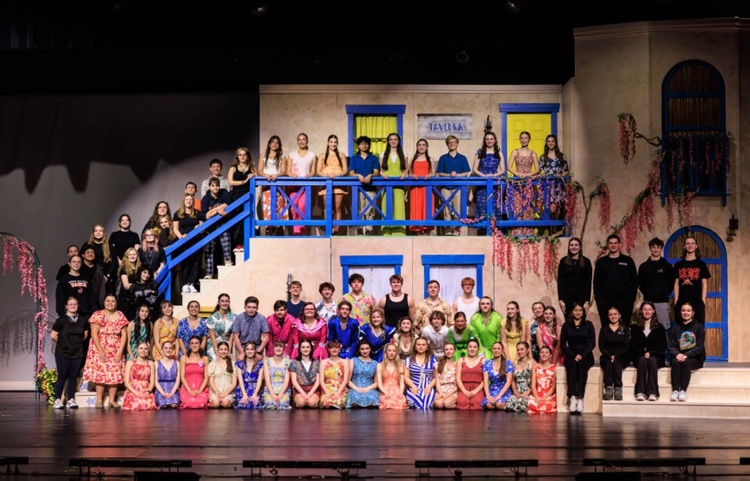 cast and crew on stage