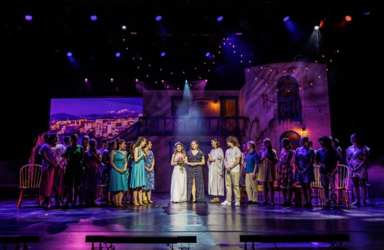 scene with multiple students on stage