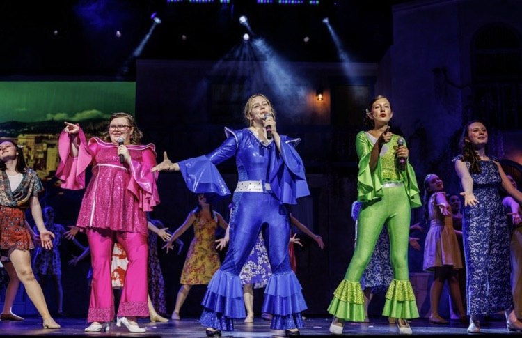 musical leads dancing on stage
