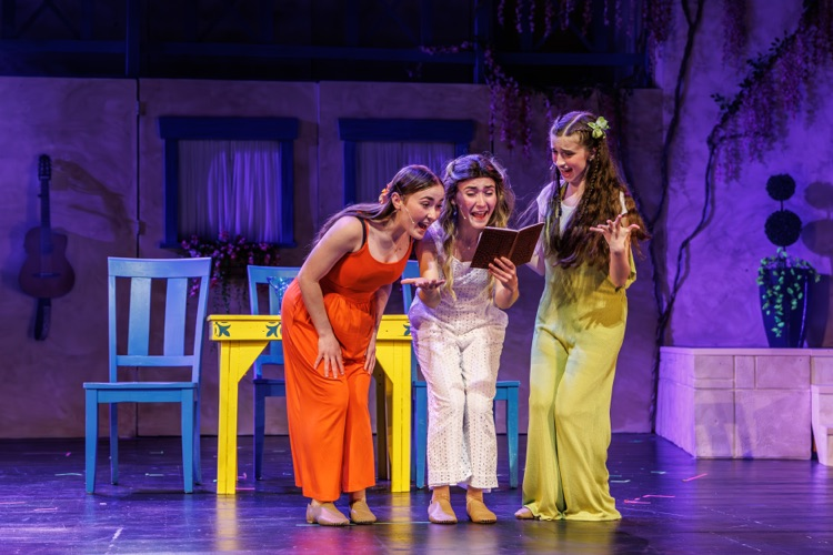 students acting on stage