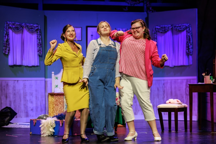 students singing on stage