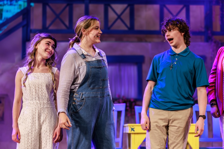 students acting on stage