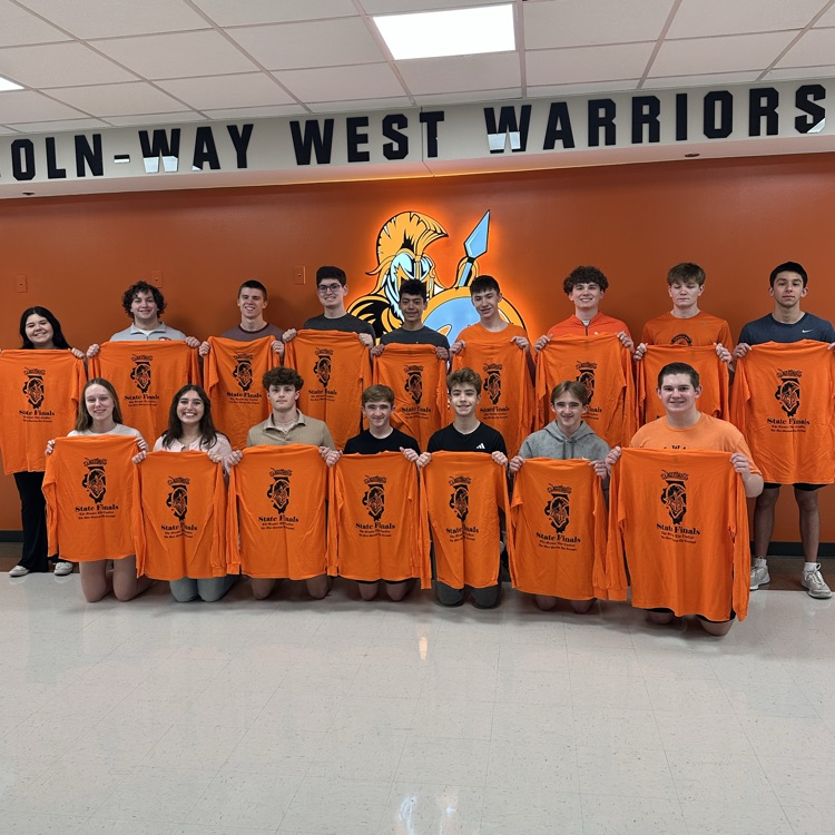 students holding state shirts 