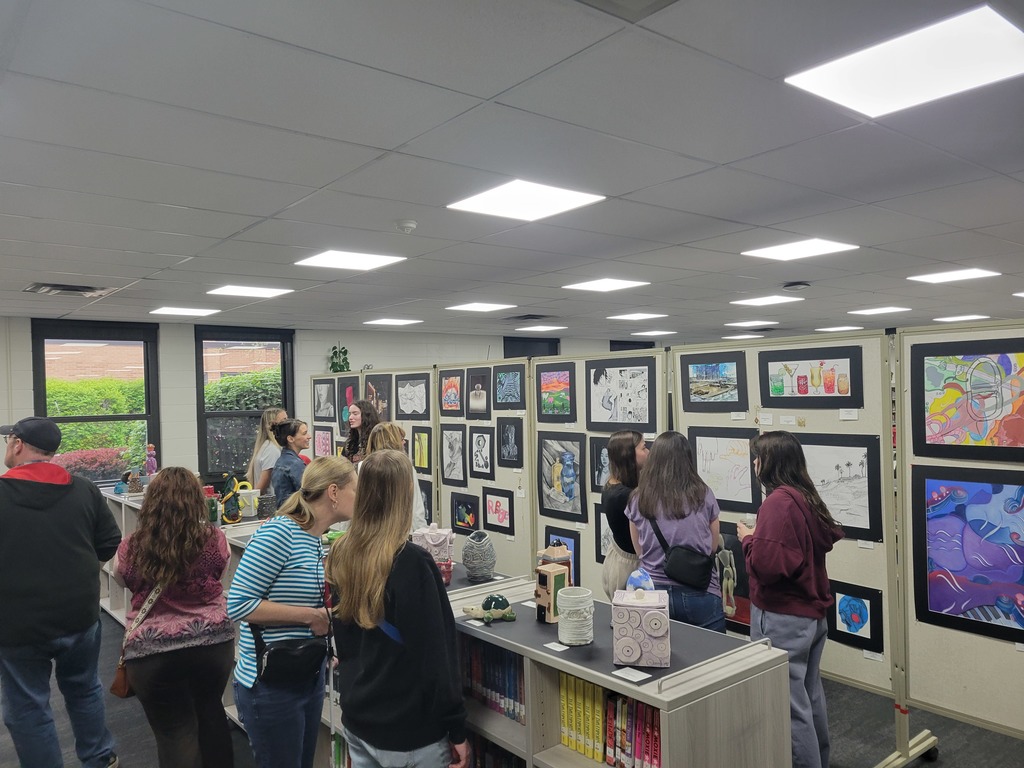 Family members viewing the Spring Art Show