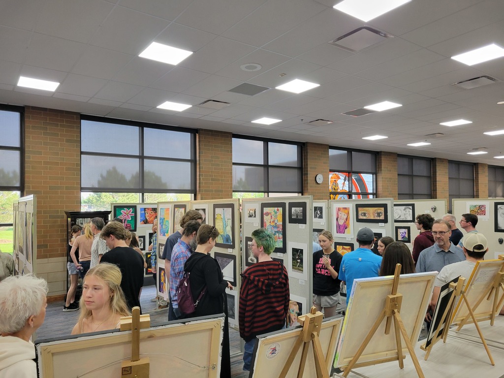Family members and students viewing the Spring Art Show