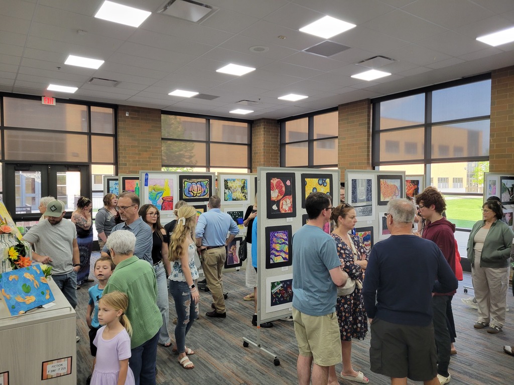 Family members viewing the Spring Art Show
