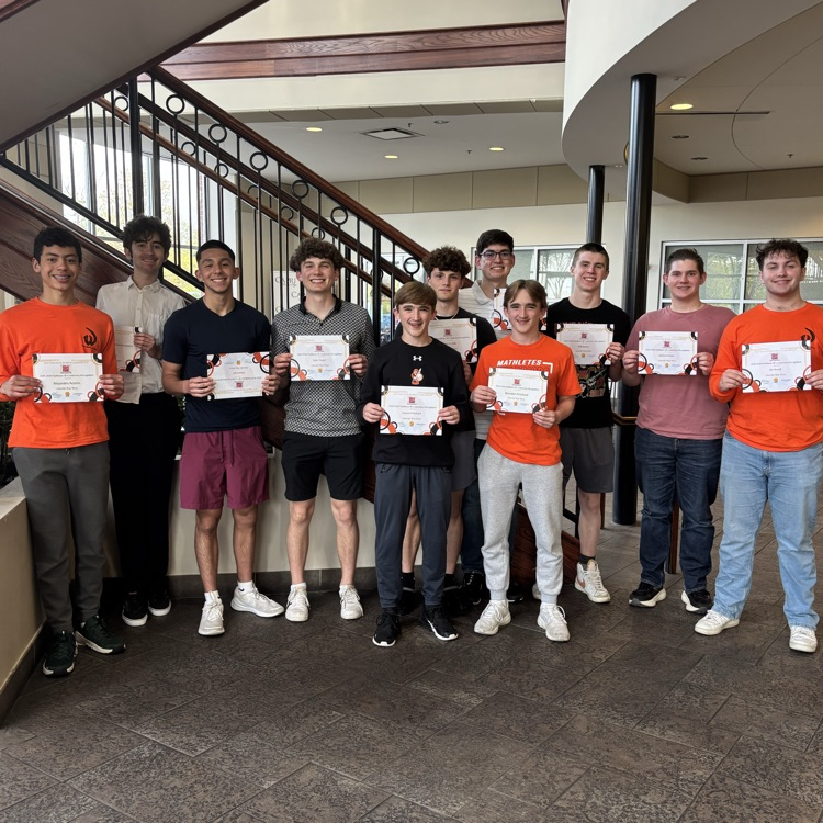 eleven students holding certificates 