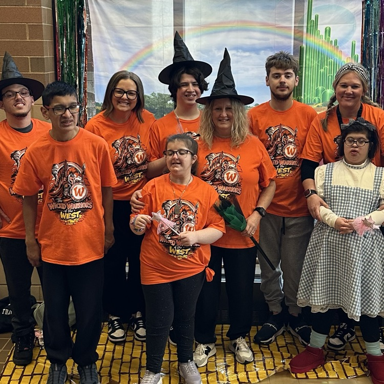 one class of students and staff posing for a photo