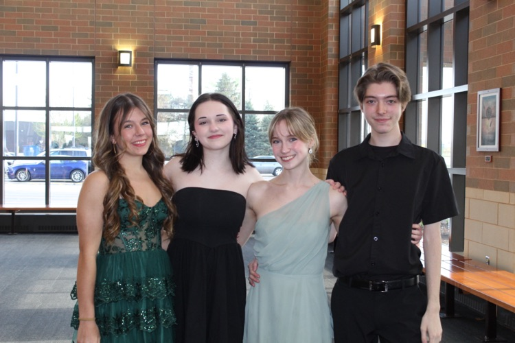 four students at event