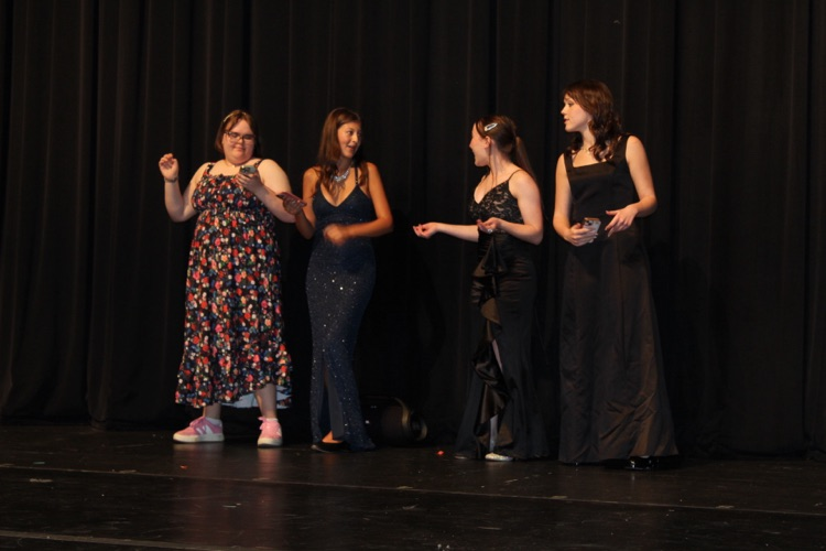 students acting on stage