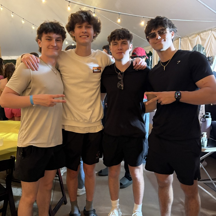 multiple students posing for a photo at event