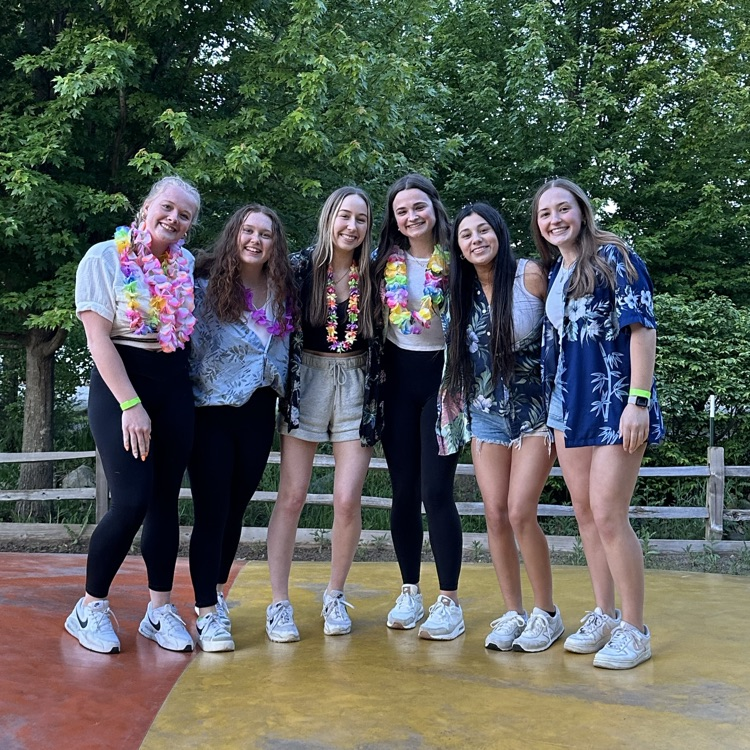 multiple students in Hawaiian shirts posing for a photo 