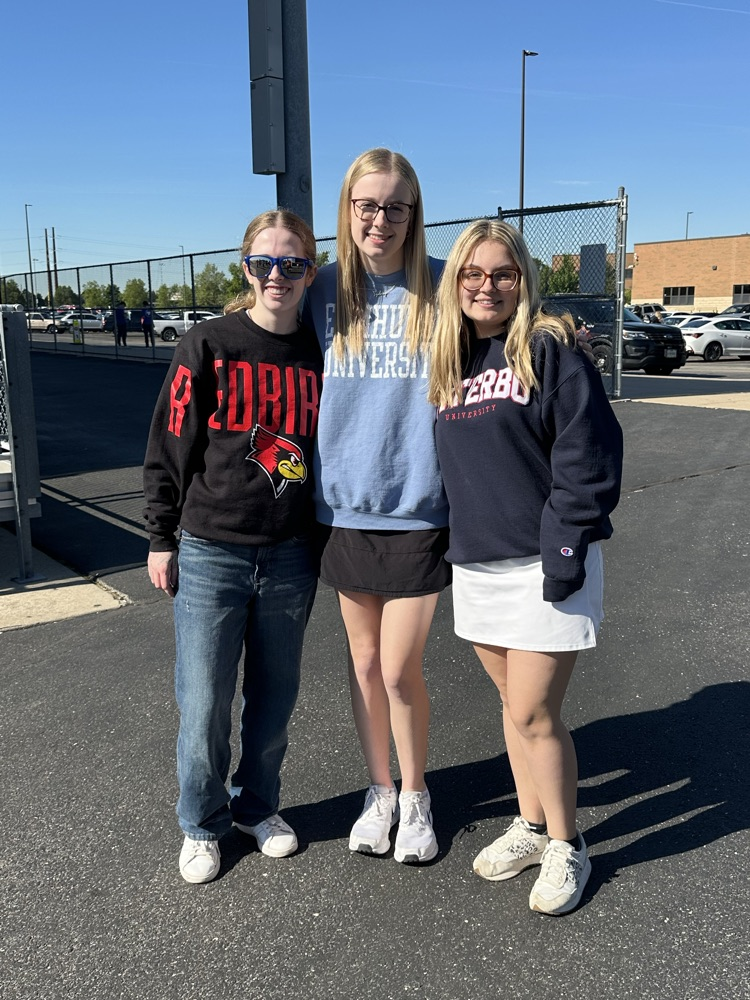 three students in front of the station 