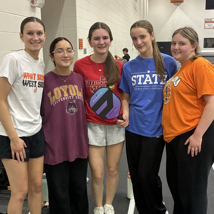 multiple students posing for a photo at pickleball