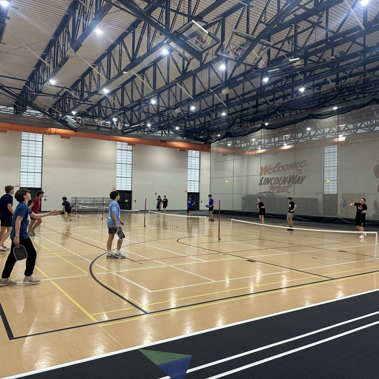 action photo of multiple pickleball games