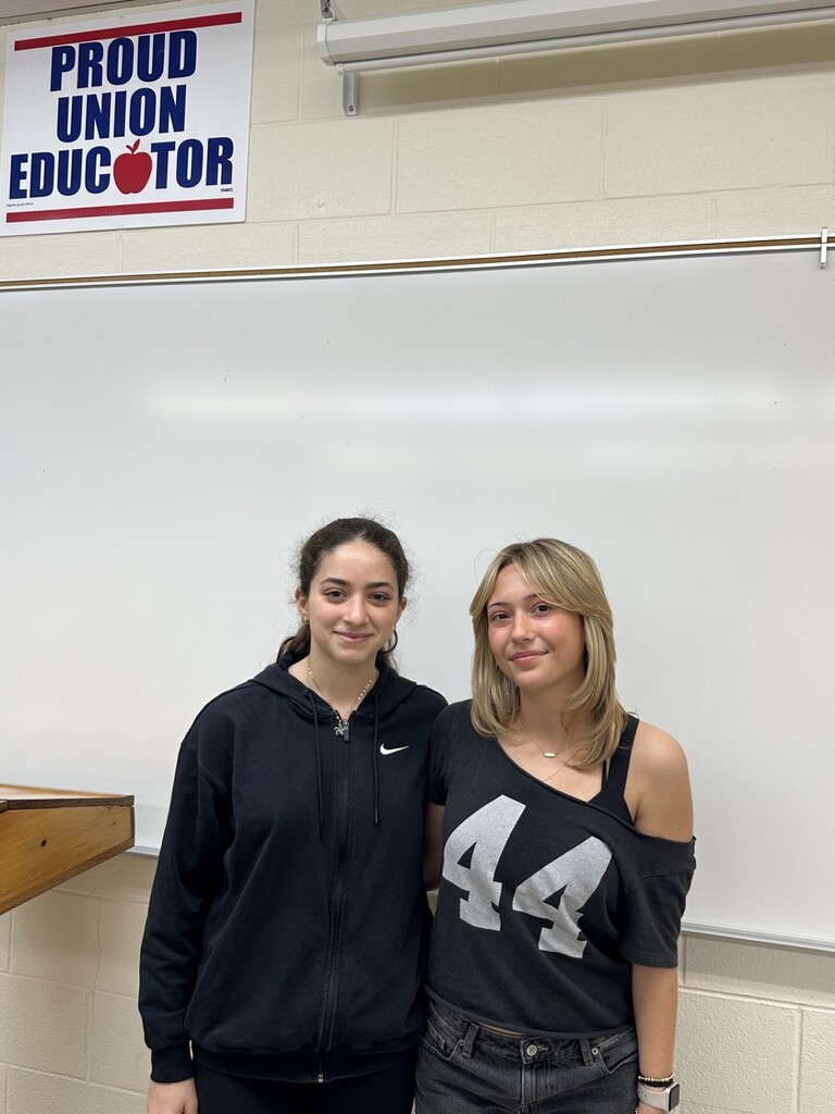 Two students pose for contacting Senator Hastings on a bill