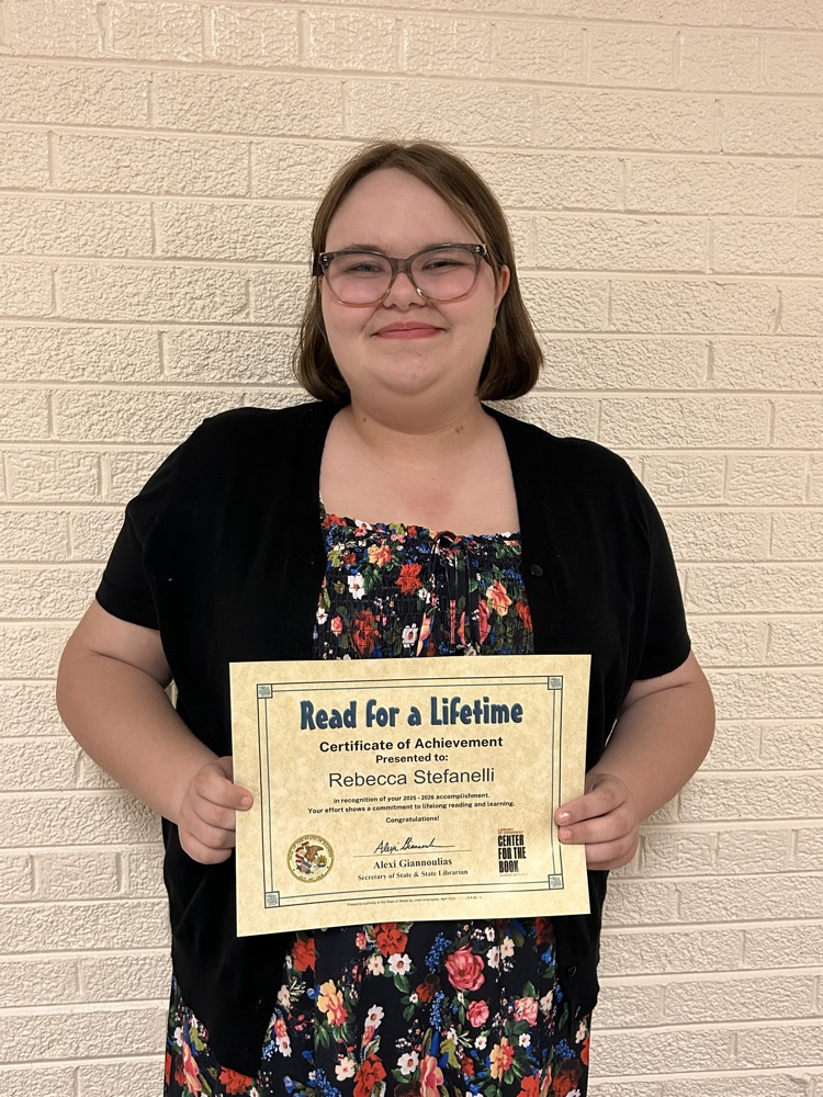 student holding certificate