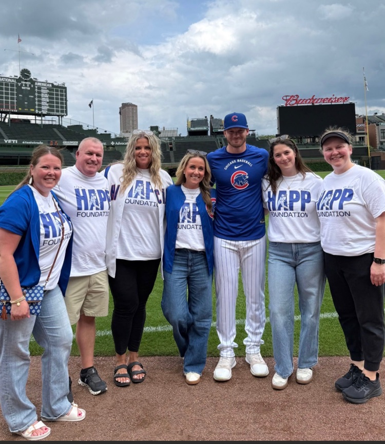 staff on the field with cubs player