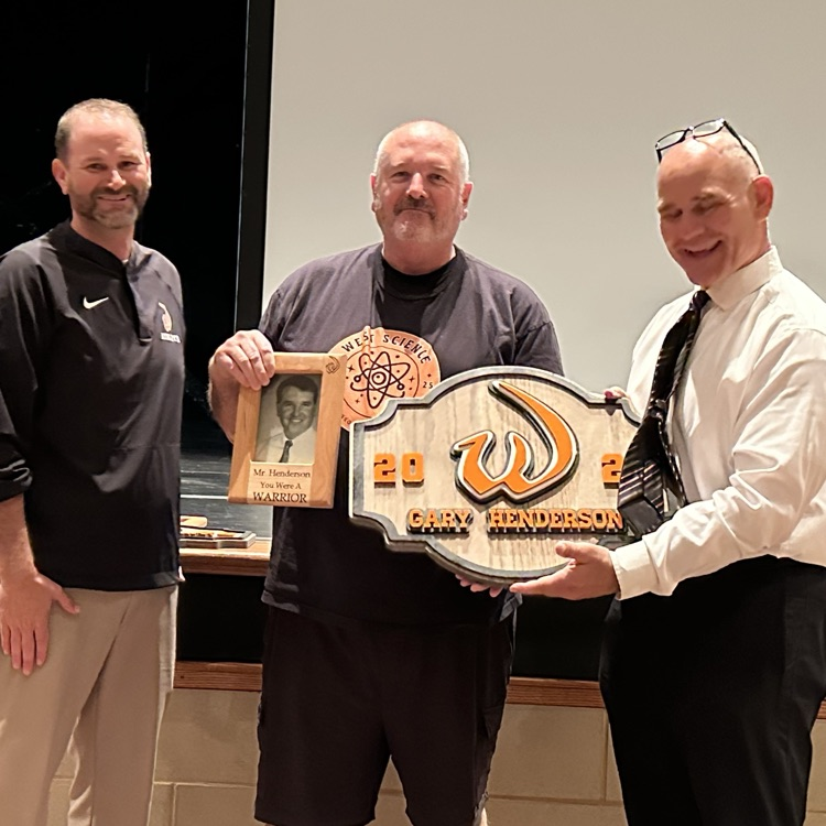 staff member with plaque