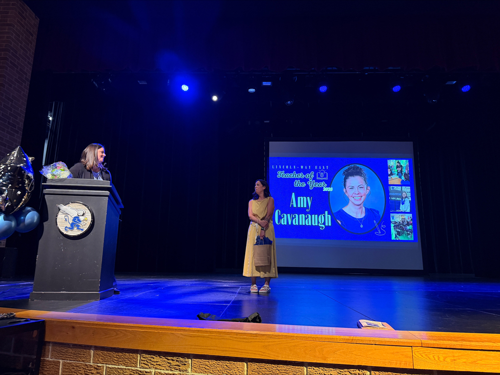 Mrs. Cavanaugh is awarded Teacher of the Year on stage at LWE