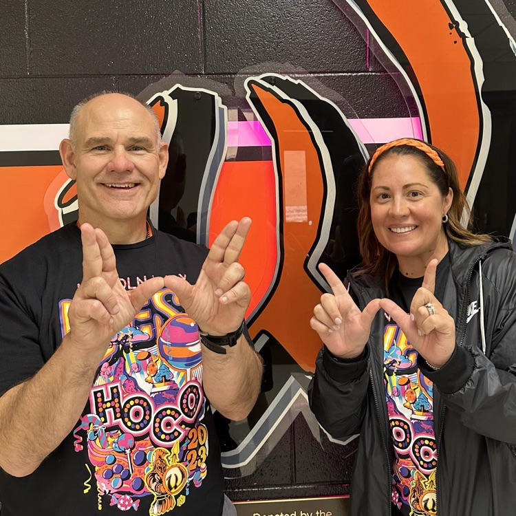 staff members posing with a W