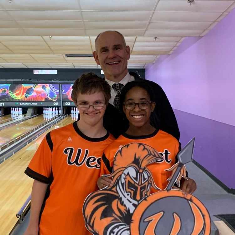 principal and students at bowling alley