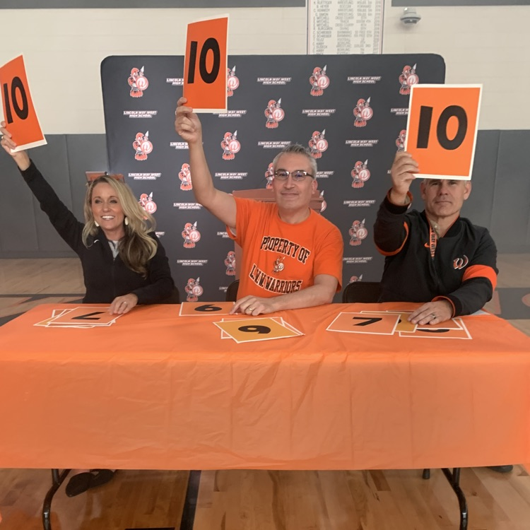 three staff at scorers table