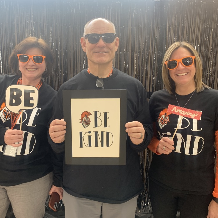 staff with Be Kind posters
