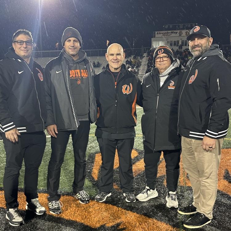 athletic staff at football game
