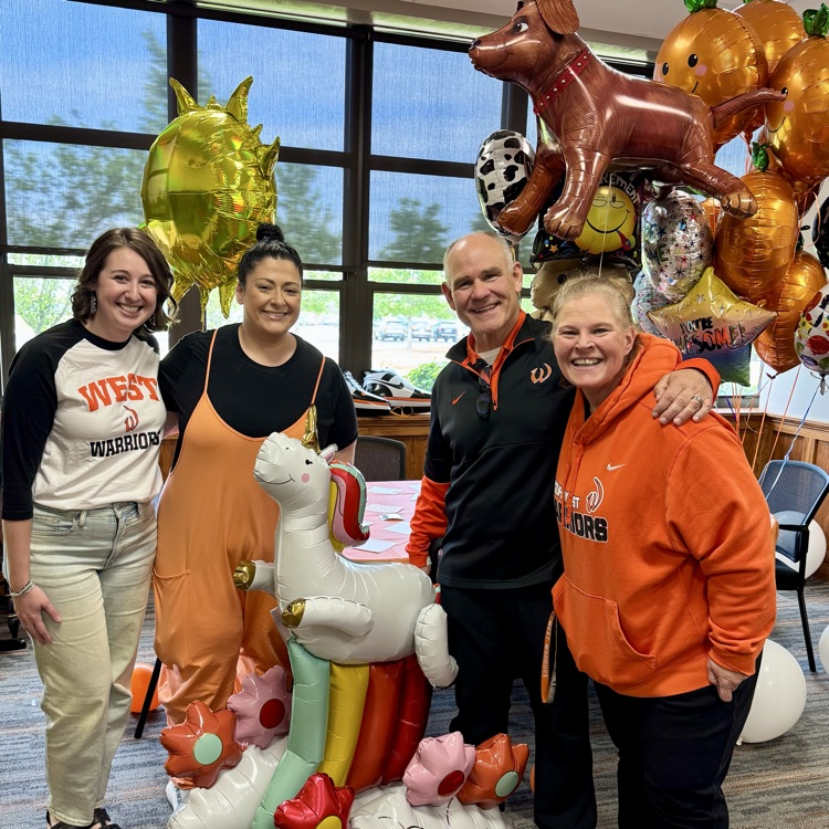 staff in office with balloons
