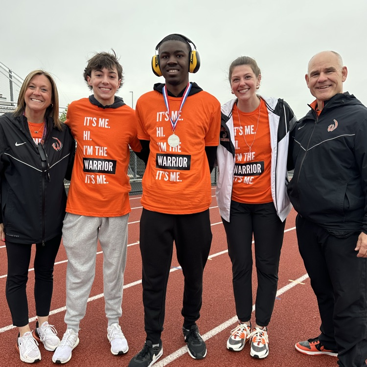 staff members with students at event