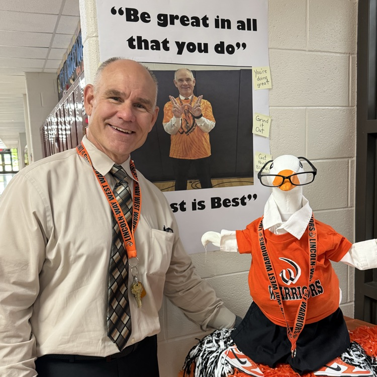 principal posing for a photo