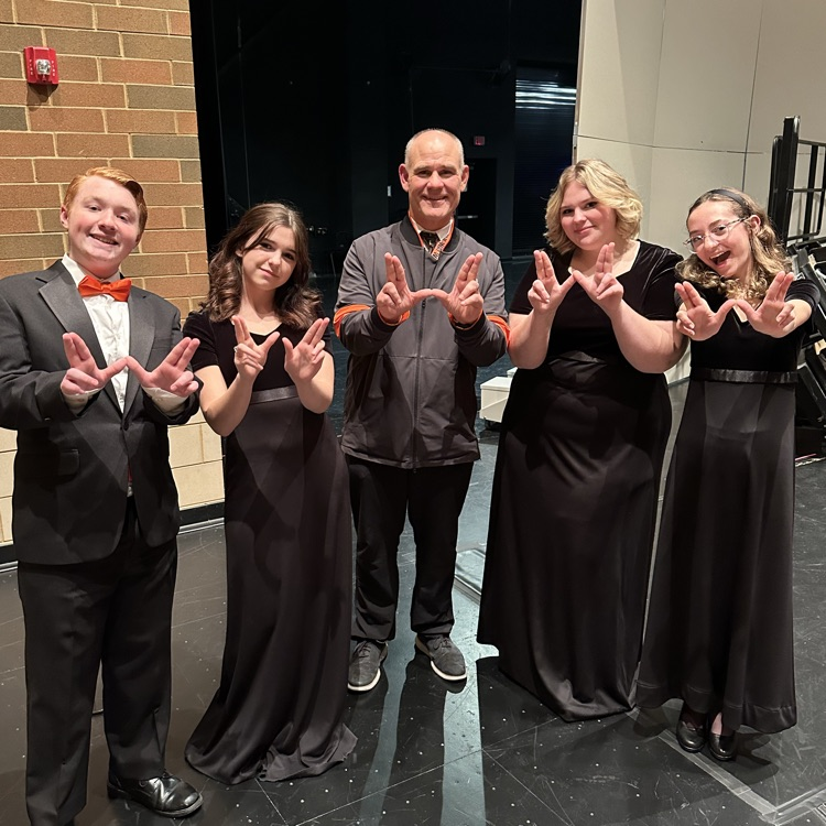 principal with student at music concert