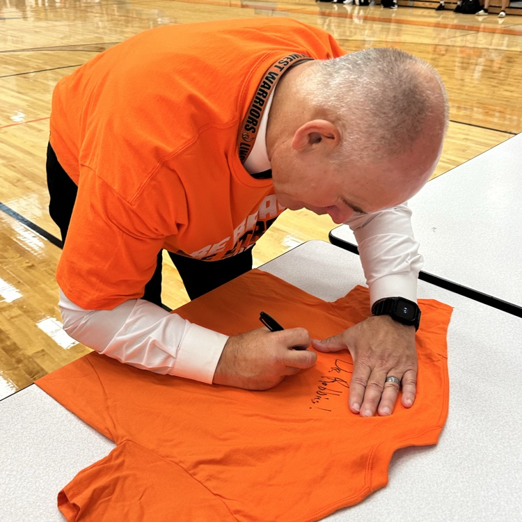 principal signing shirt